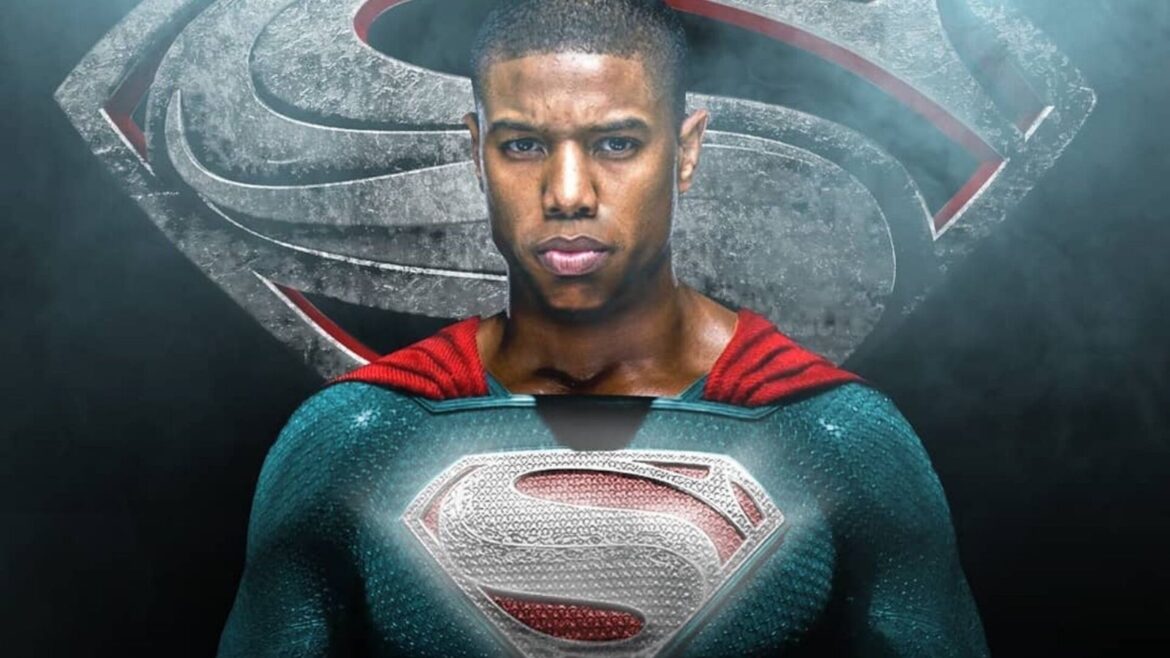A man in superman costume with the hood up.