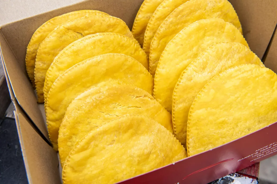 A box of corn tortillas sitting on top of the table.